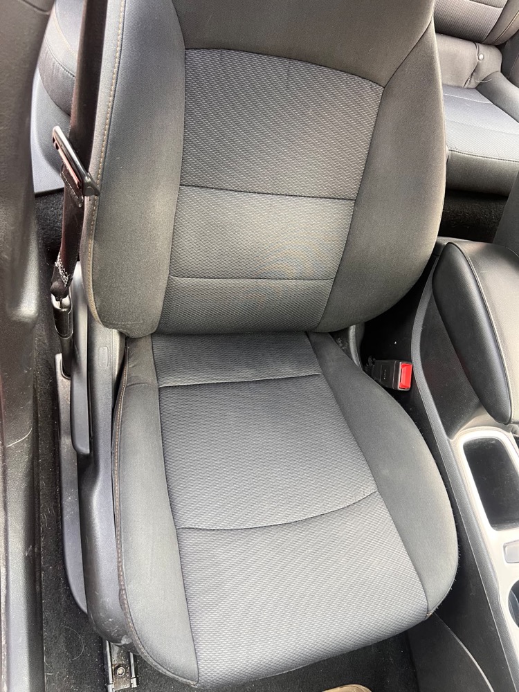 Same fabric car seat after professional interior cleaning, clean and stain free