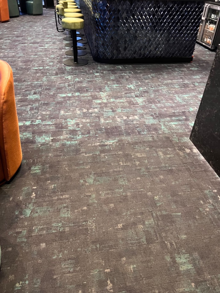 Commercial restaurant carpet cleaned in Kelowna showing refreshed patterned flooring